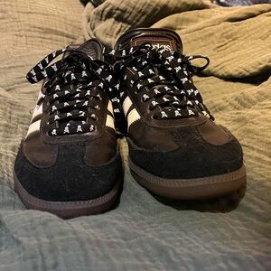 Black and white adidas sambas with skull laces
us size 7